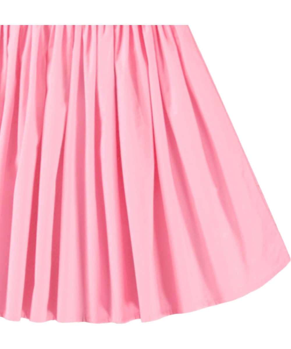 Christal - Pink Lemonade - Beige kjole til børn i økologisk bomuld med en tætsiddende ribbet jerseytop, rund hals og et voluminøst rundskåret skørt i bomuldspoplin.