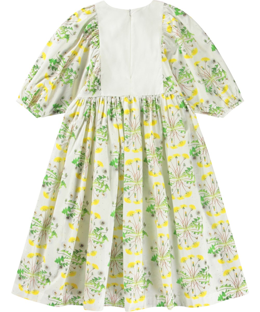 Cinzia - Dandelion Dotty - Hvid kjole til børn i økologisk bomuld med rund hals og pufærmer med knap.