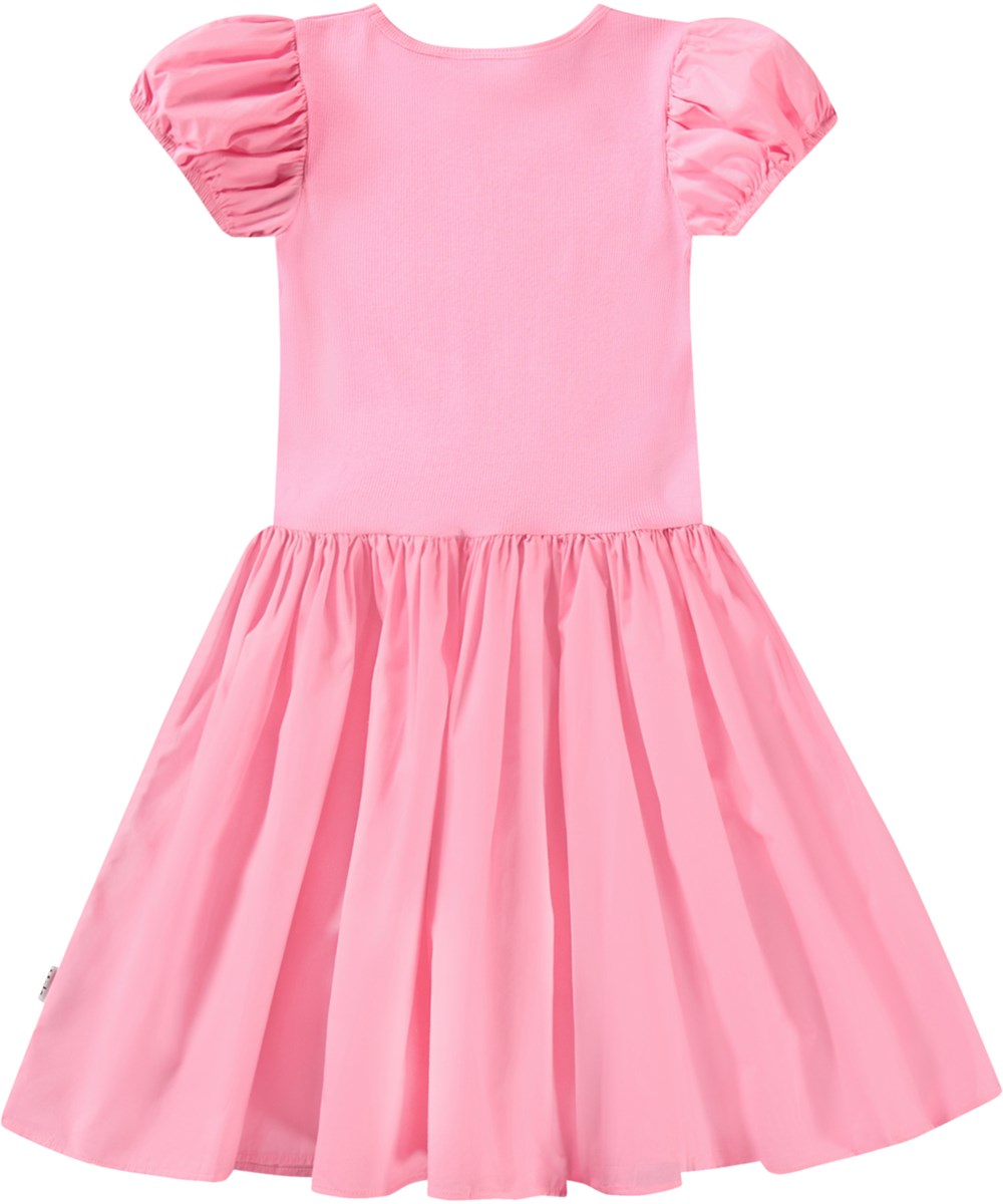 Cleopatra - Pink Lemonade - Kortærmet pink kjole til børn i økologisk bomuld med en tætsiddende jerseytop og et voluminøst skørt i bomuldspoplin.