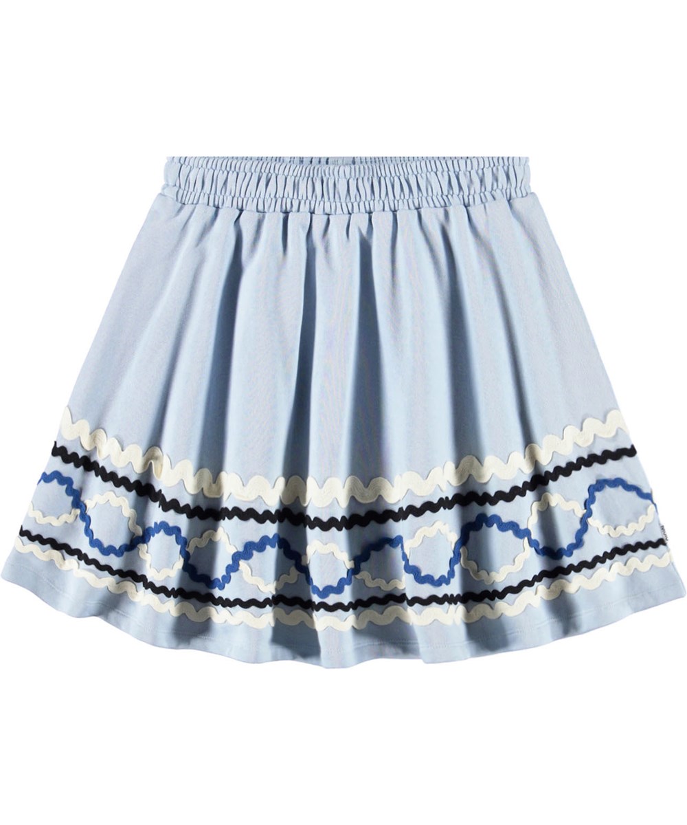 Barbera - Blue Moon - Lyseblå nederdel til børn i økologisk bomuld med farvestrålende påsyede bånd.