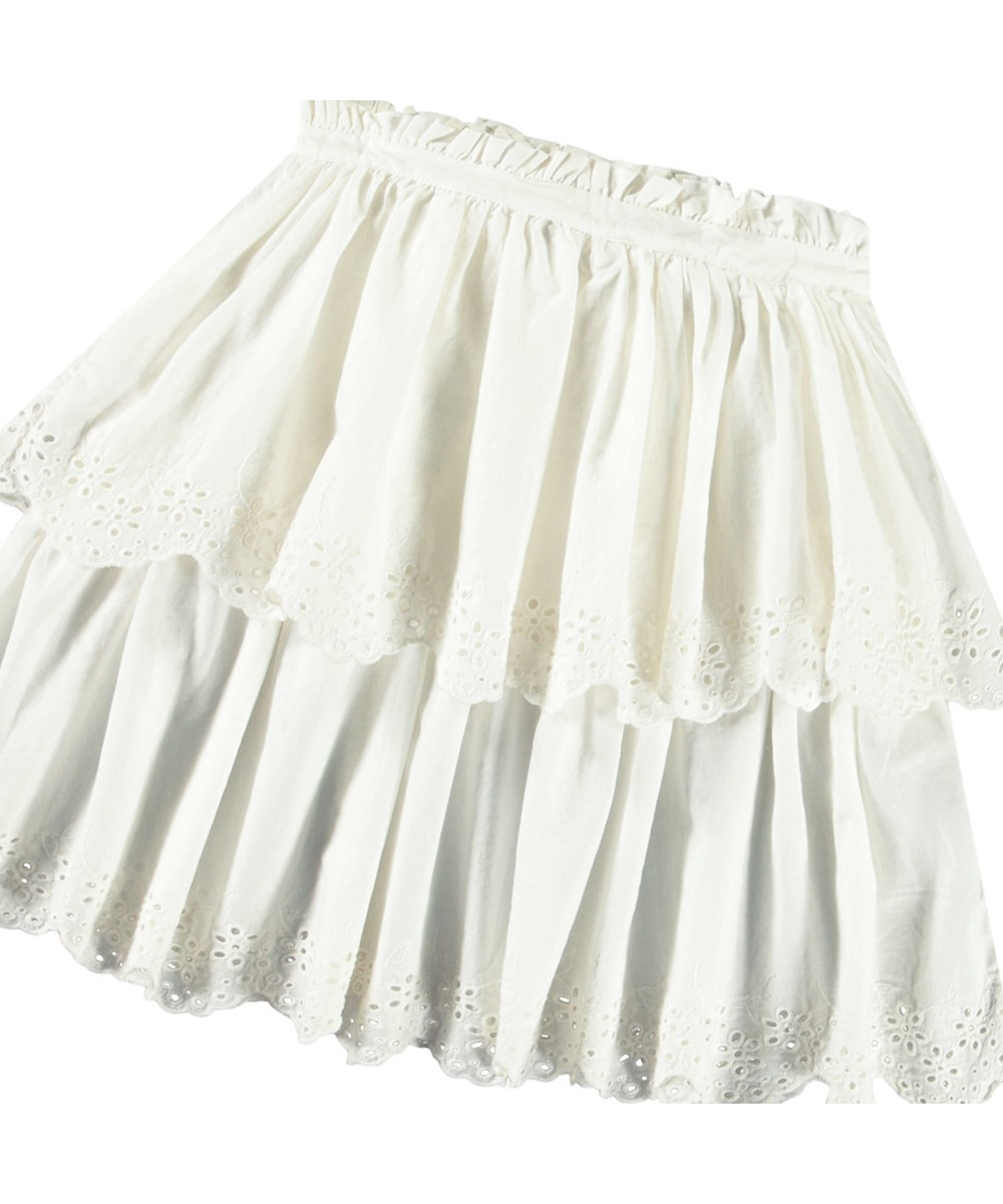 Brianna - Crisp White - Hvid nederdel i økologisk bomuld til børn. Nederdelen er mellemlang og har to skørter i forskellige længder med broderi anglaise langs kanten.