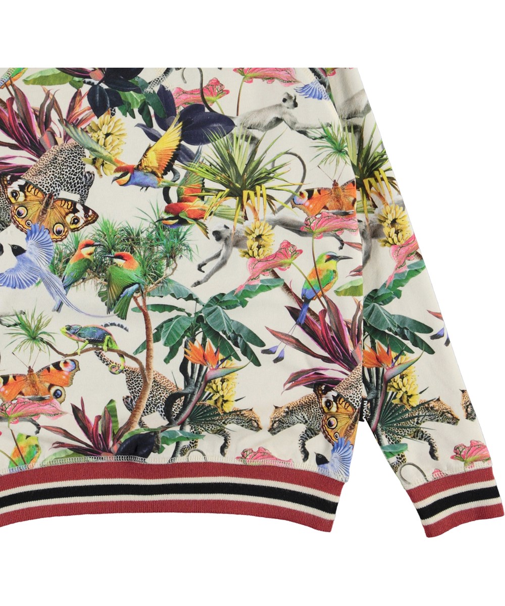 Raewyn - Imaginary Jungle - Økologisk bluse med print af farverige dyr