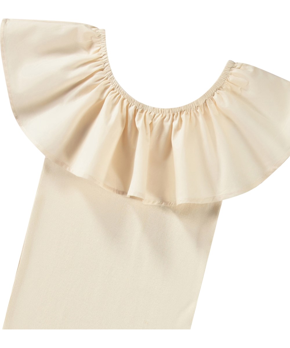 Reca - Brazilian Sand - Beige off shoulder-top uden ærmer i blødt økologisk bomuld med stretch.
