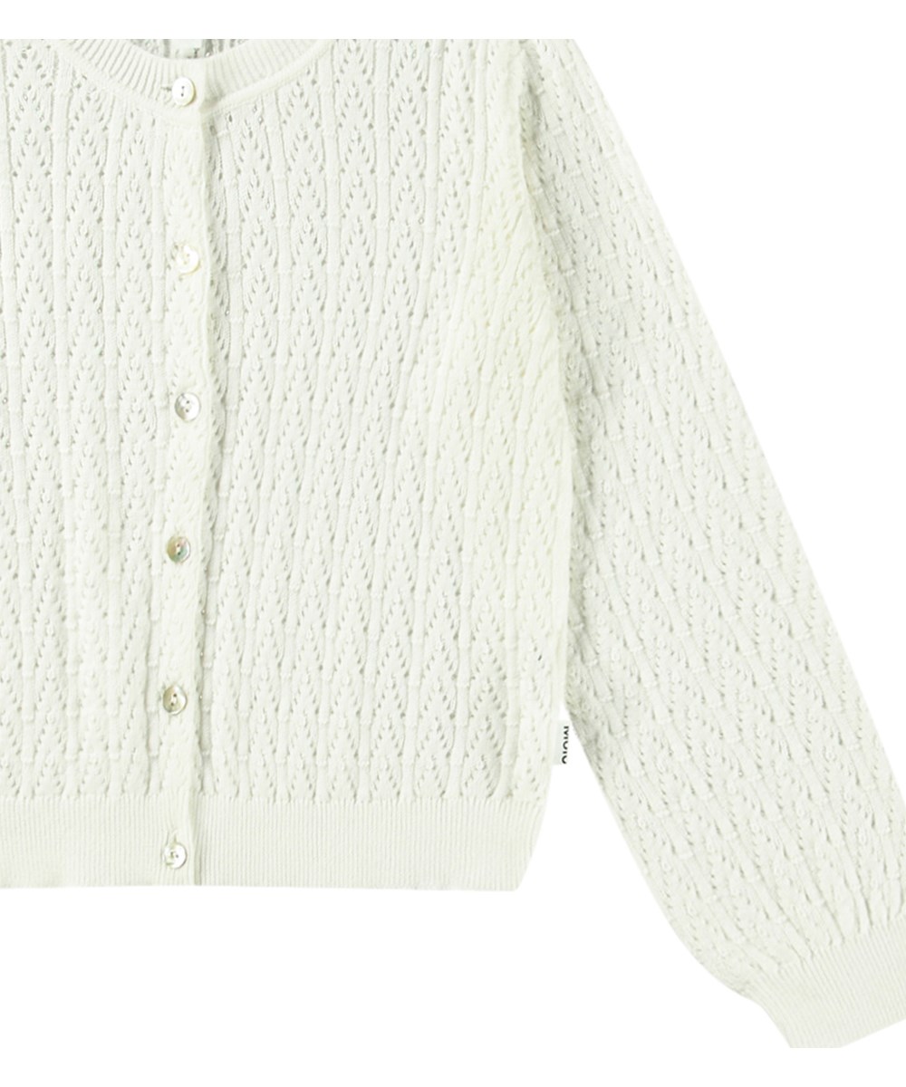 Gillian - Crisp White - Hvid strikket cardigan til børn i blødt økologisk bomuld med flot hulmønster.