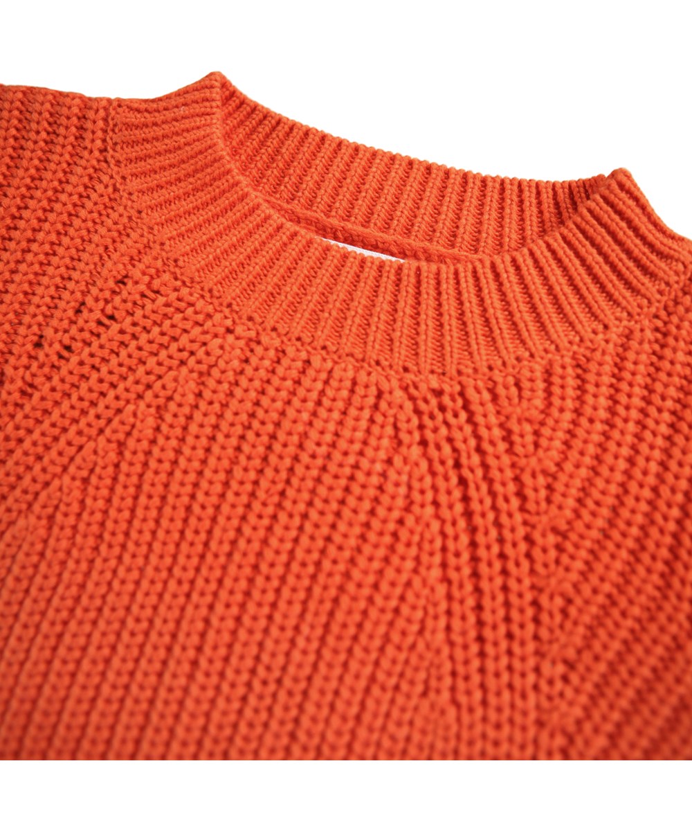 Gillis - Rising Sun - Orange langærmet striktrøje til børn i blødt økologisk bomuld med rund hals.