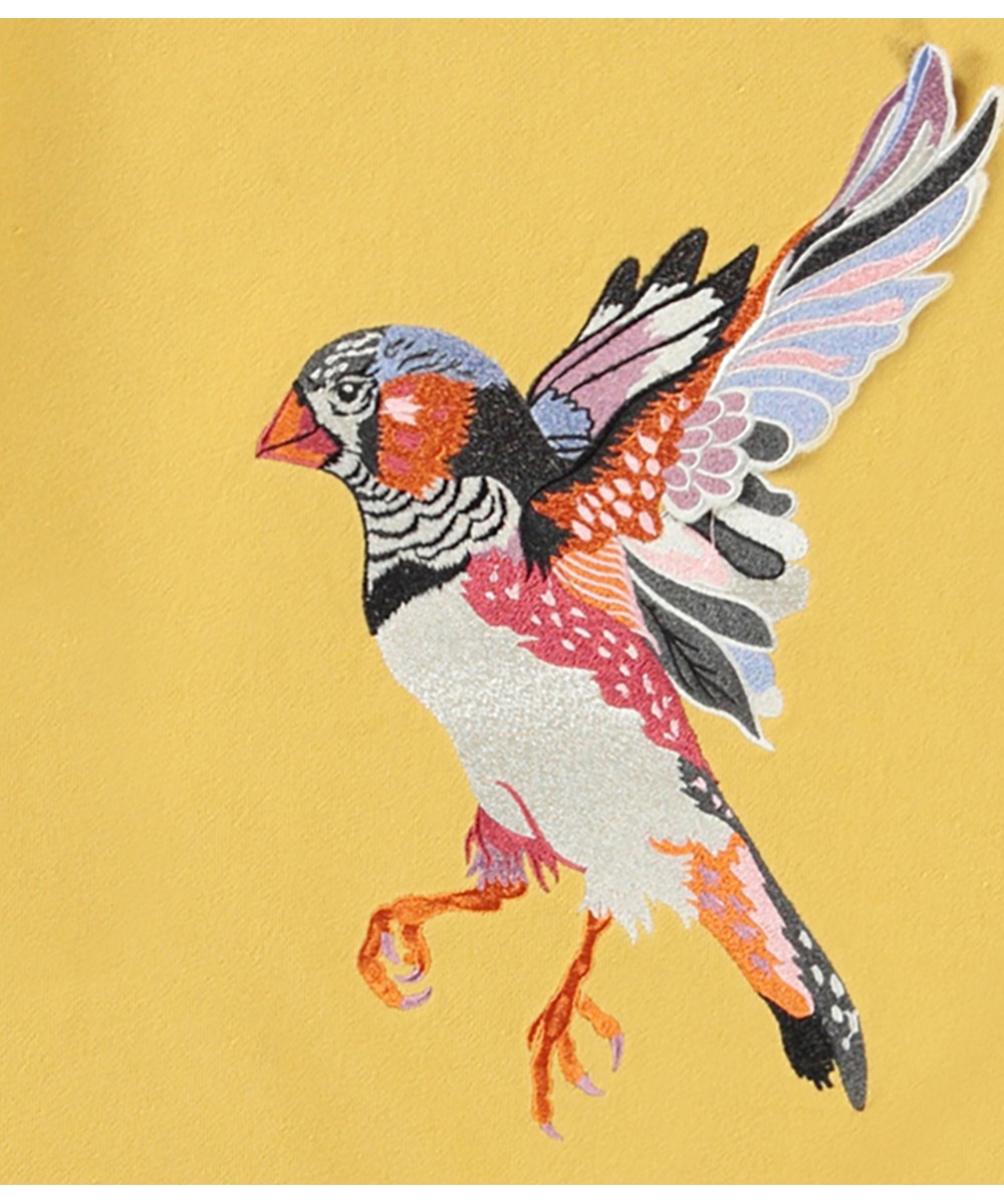 Mandy - Straw Field - Økologisk gul sweatshirt med broderi af en fugl