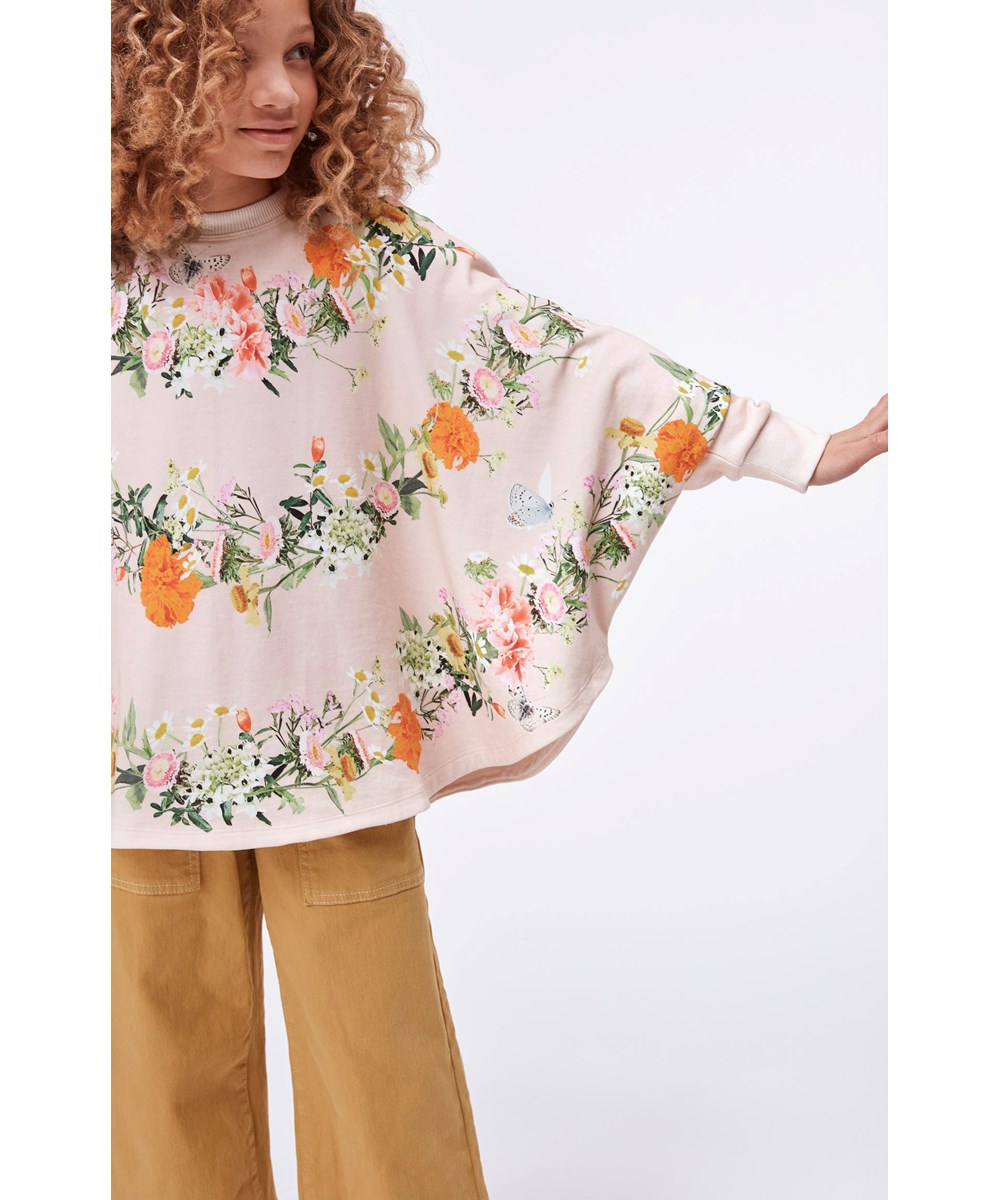 Marcella - Garlands - Rosa poncho med blomster print
