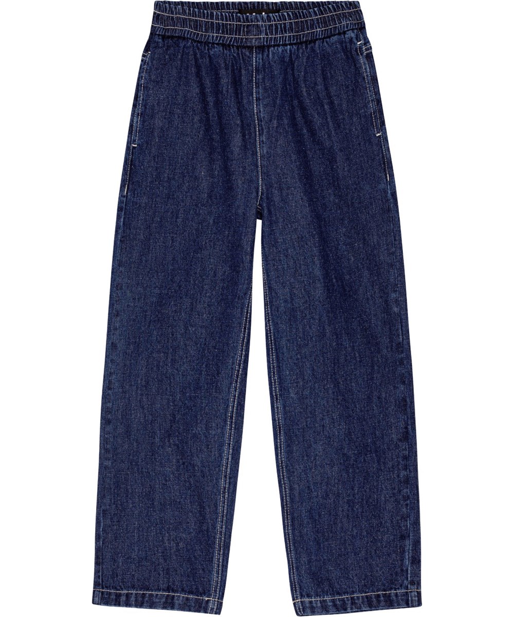 Aster - Oceanic Denim - Löst sittande mörkblå jeans med elastisk midja och fickor.