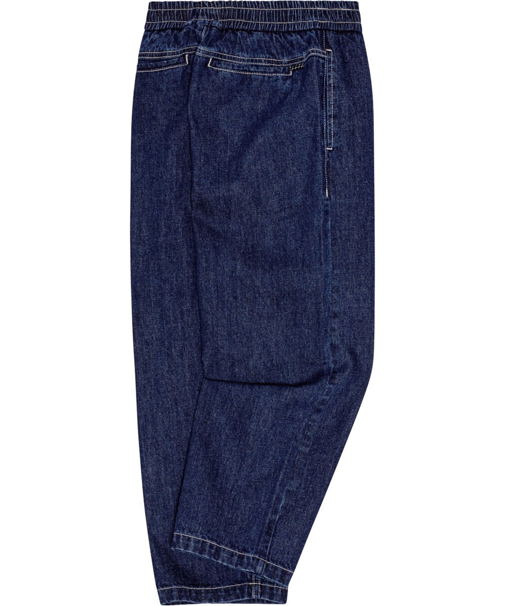 Aster - Oceanic Denim - Löst sittande mörkblå jeans med elastisk midja och fickor.