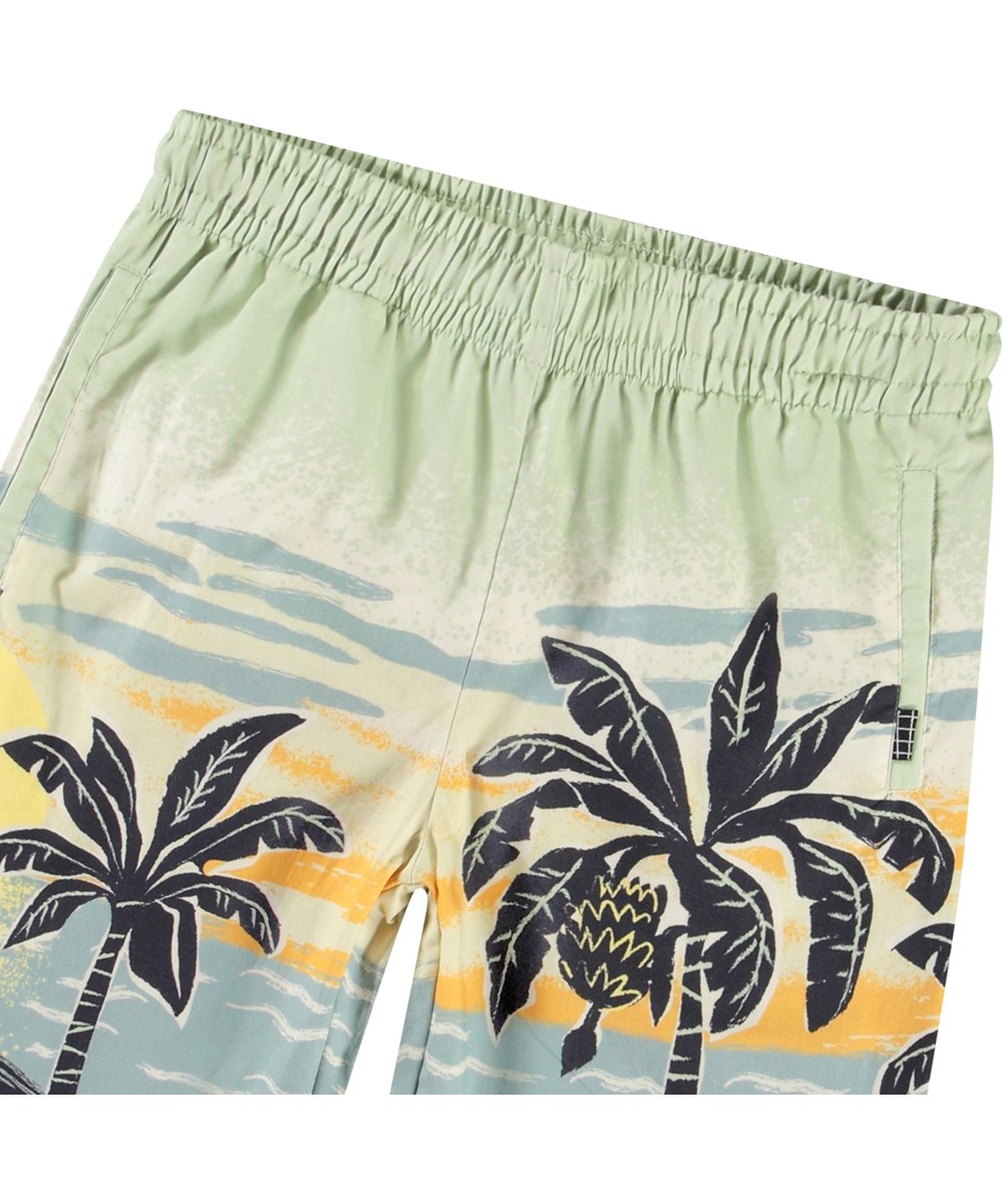 Adi - Beach Banana - Shorts i ekologisk bomull med palmmönster för barn.