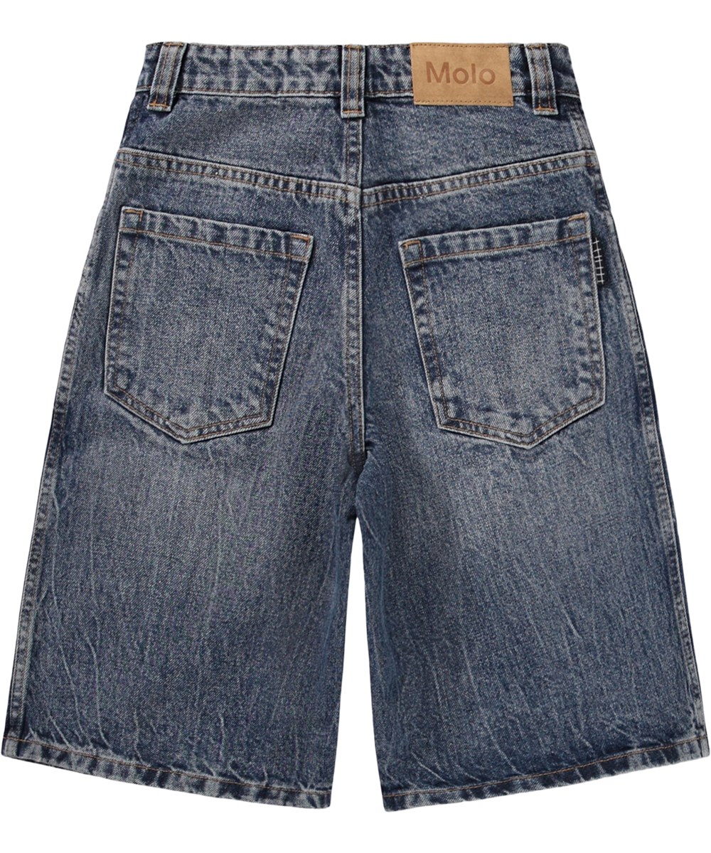 Alphie - Creased Indigo - Blå baggy jeansshorts för barn i ekologisk bomull med justerbar midja