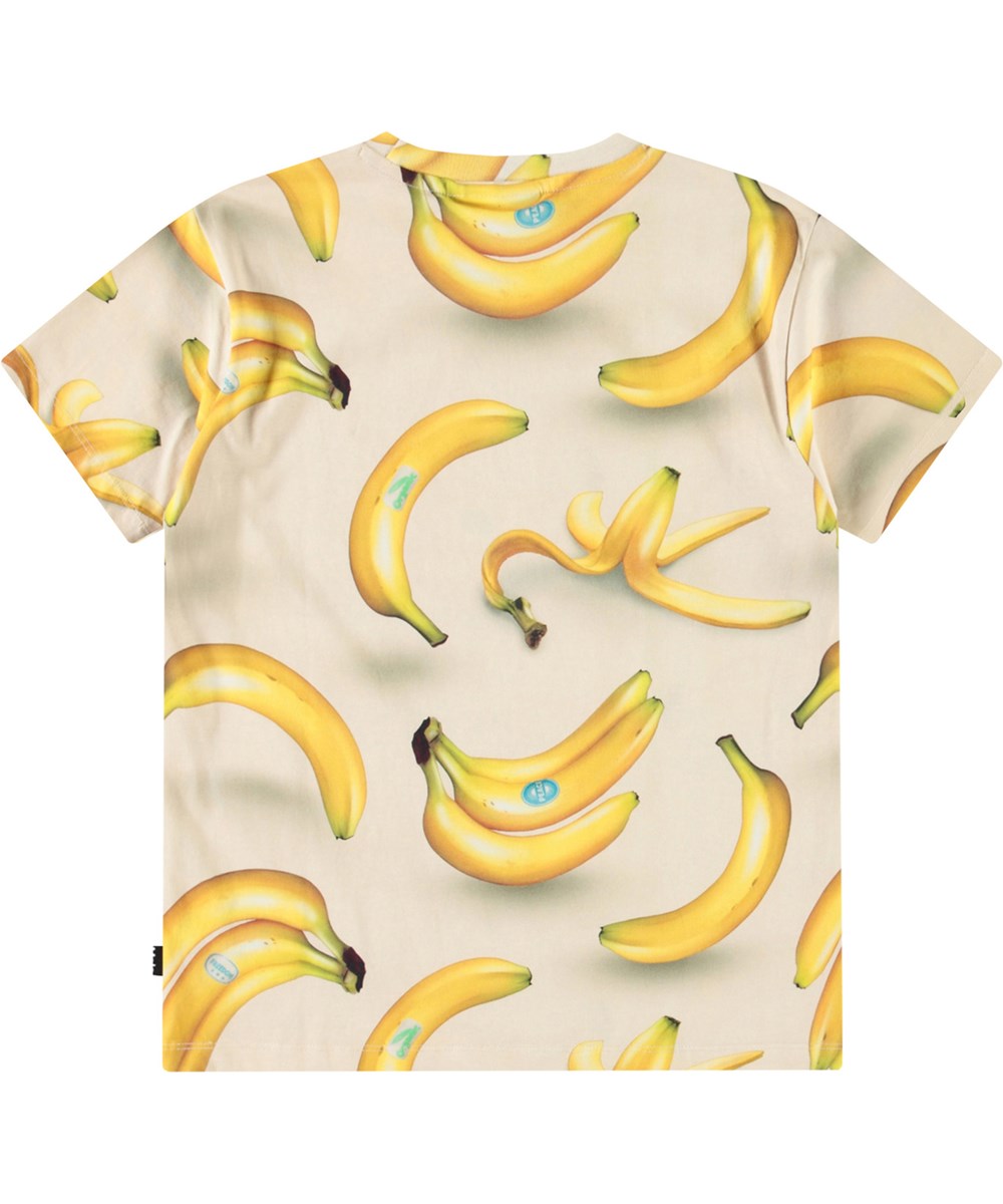 Riley - Bananas - Beige T-shirt med tryck för barn i mjuk ekologisk bomull med korta ärmar och ribbad halsringning.