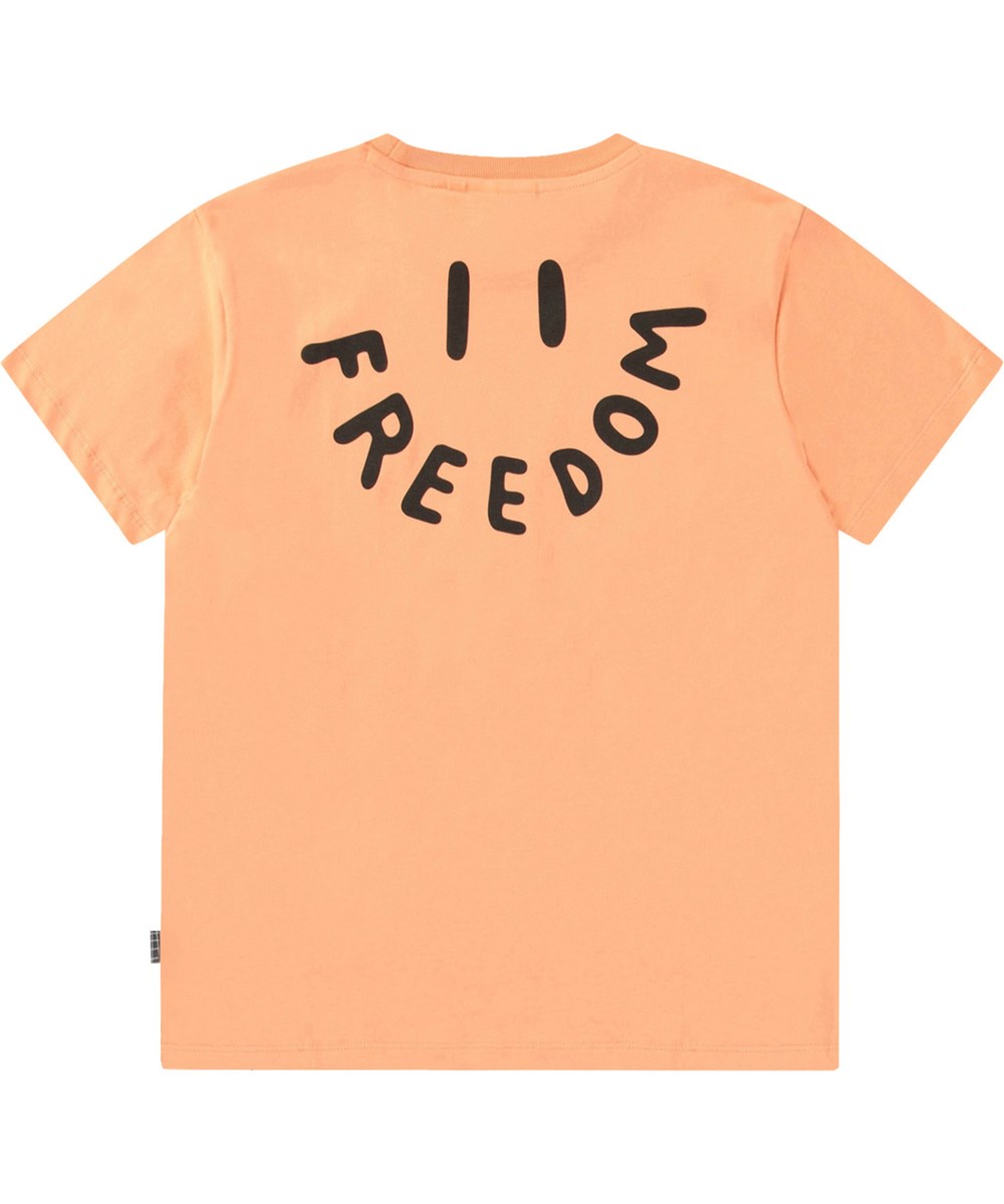 Riley - Cantaloupe - Orange t-shirt med tryck för barn i mjuk ekologisk bomull med korta ärmar och ribbad halsringning.