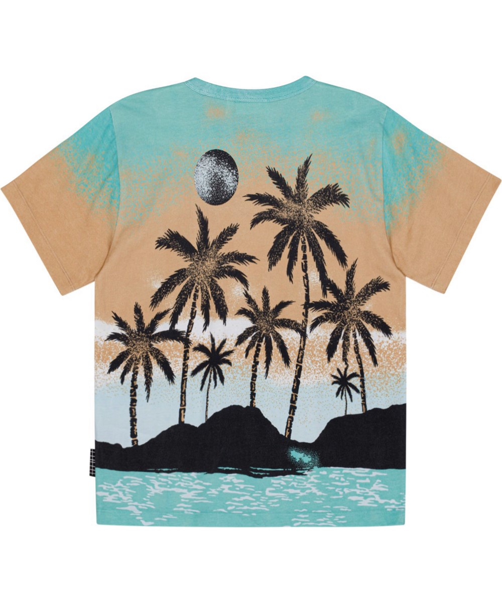 Riley - Holiday Island - Sandfärgad och turkos ekologisk t-shirt med hawaii mönster.