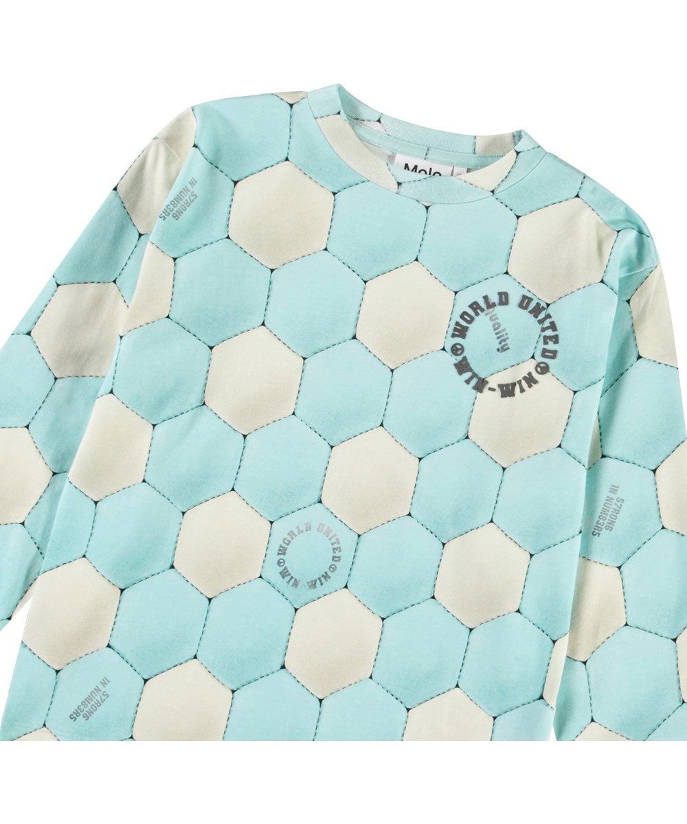 Rube - Football Aqua - Blå och beige långärmad topp för barn i ekologisk bomull med ribbad kant på halsen och ärmarna, samt en lös passform.