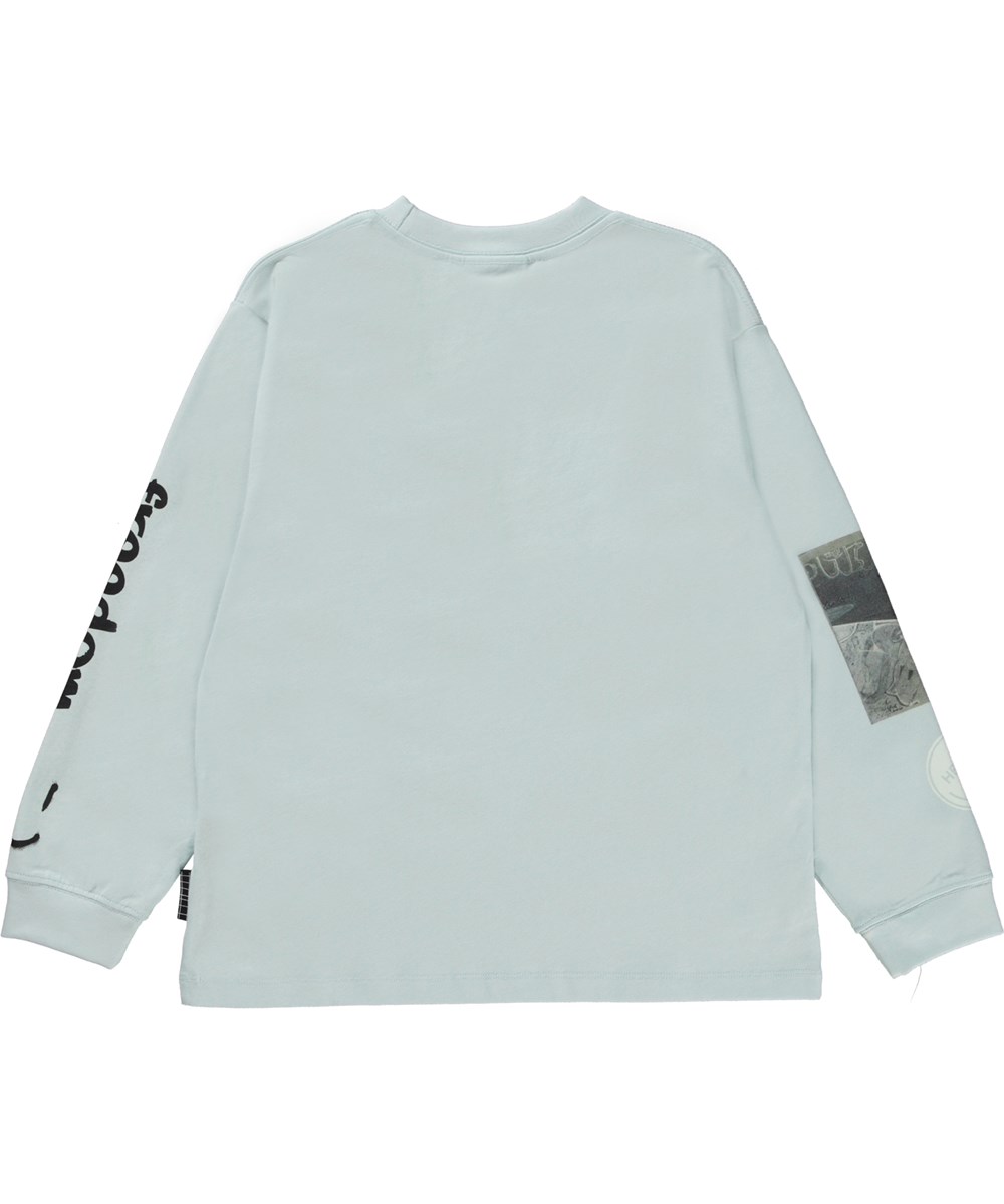 Rube - Skate Mix - Ljusblå ekologisk t-shirt med skejtmönster.