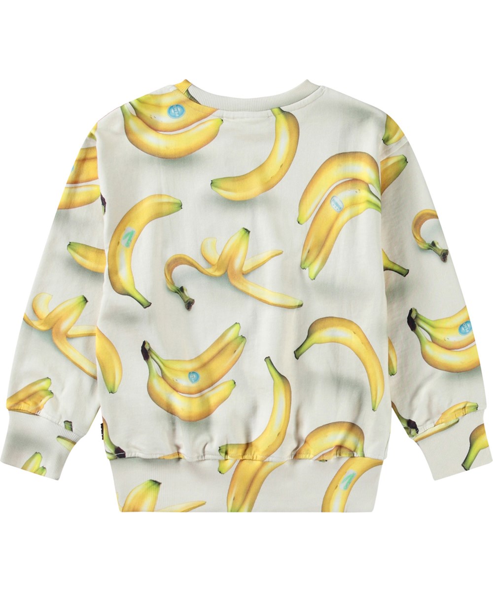 Mattis - Bananas - Beige tröja med tryck för barn i mjuk ekologisk bomull med ribbade kanter vid halsen, ärmar och nederkant på tröjan.