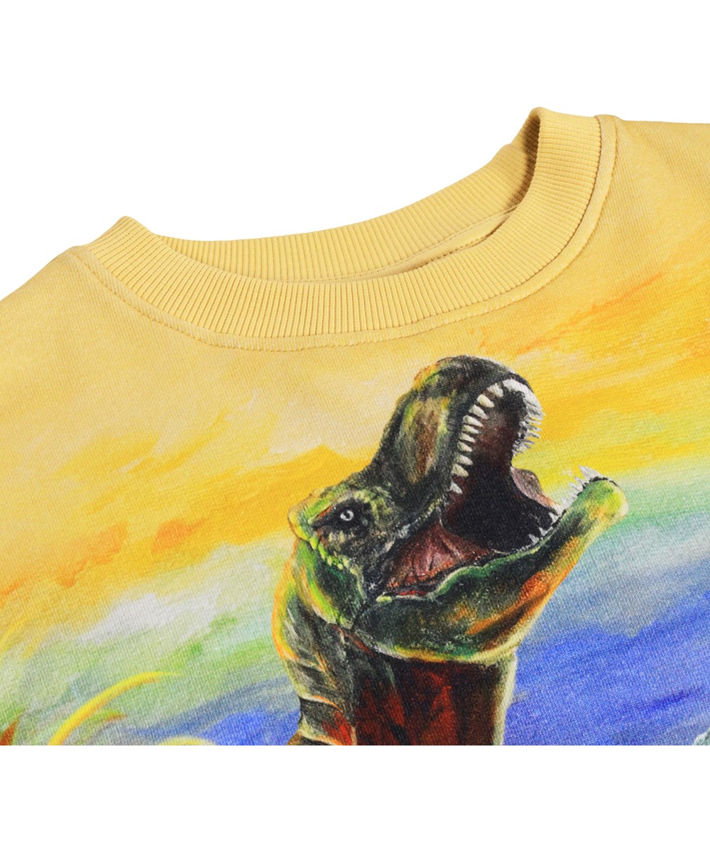 Mattis - Dino Art - Blå och vit sweatshirt för barn i ekologisk bomull med dinosauriemönster