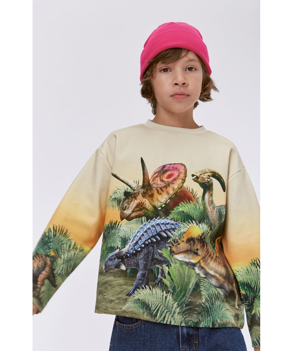 Monte -  Friendly Dinos - Gul ekologisk sweatshirt med dinosaureier.