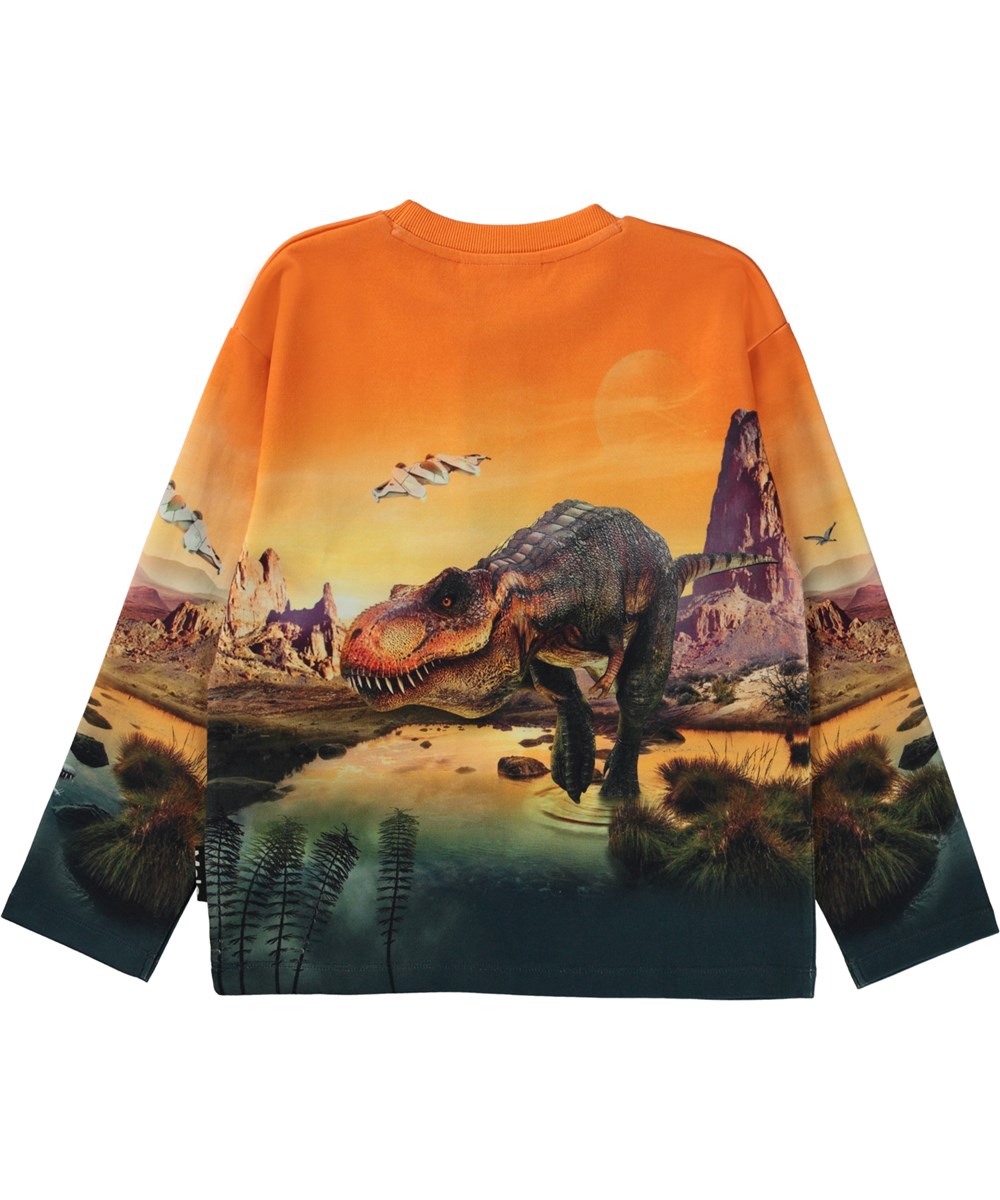 Mountoo - Dino Planet - Orange sweatshirt med dinosauriemönster.