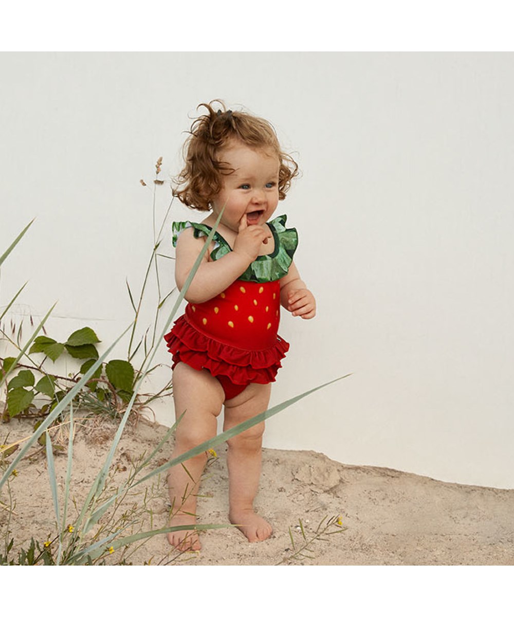 Nalani - Strawberry - UV ruffled baby swimsuit with strawberry print
