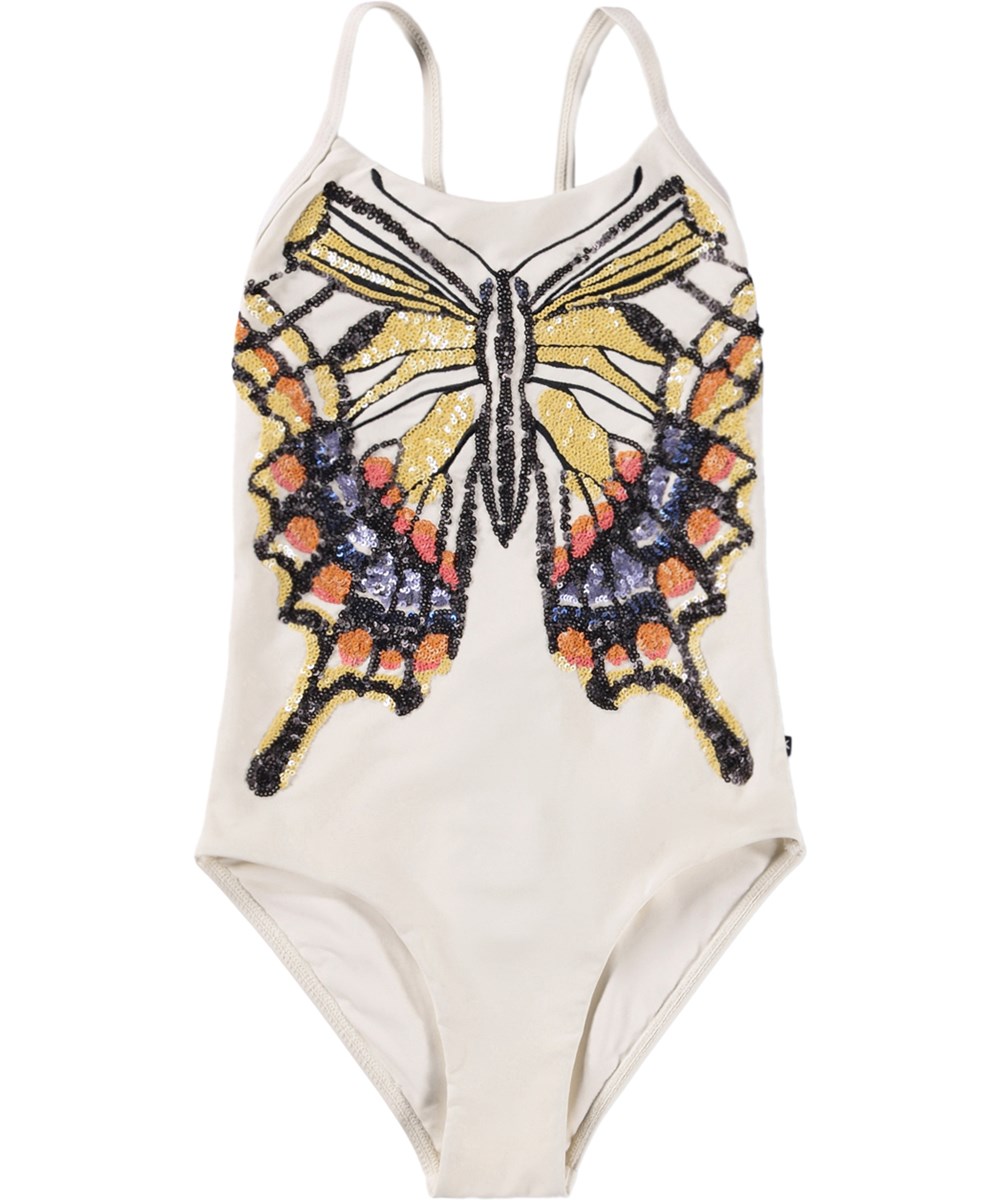 Nanna - Glitter Wings - White swimsuit with sequin motif for children made from recycled polyester with UV protection 50+.