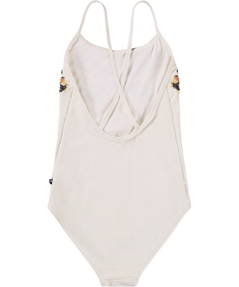 Nanna - Glitter Wings - White swimsuit with sequin motif for children made from recycled polyester with UV protection 50+.