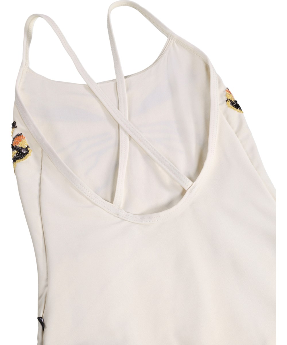 Nanna - Glitter Wings - White swimsuit with sequin motif for children made from recycled polyester with UV protection 50+.