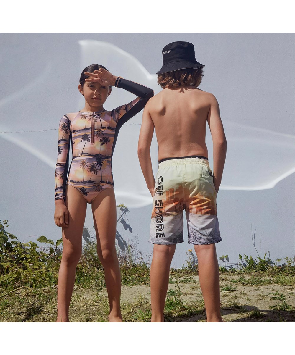 Neal - Off Shore - Long UV swim trunks with beach print 