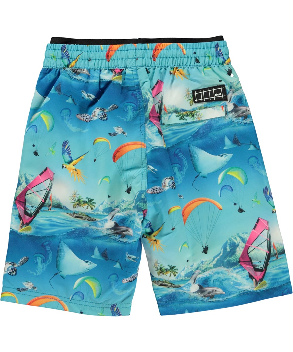 Neal - Passion For Motion - Blue swim shorts with a print of sports and dolphins 