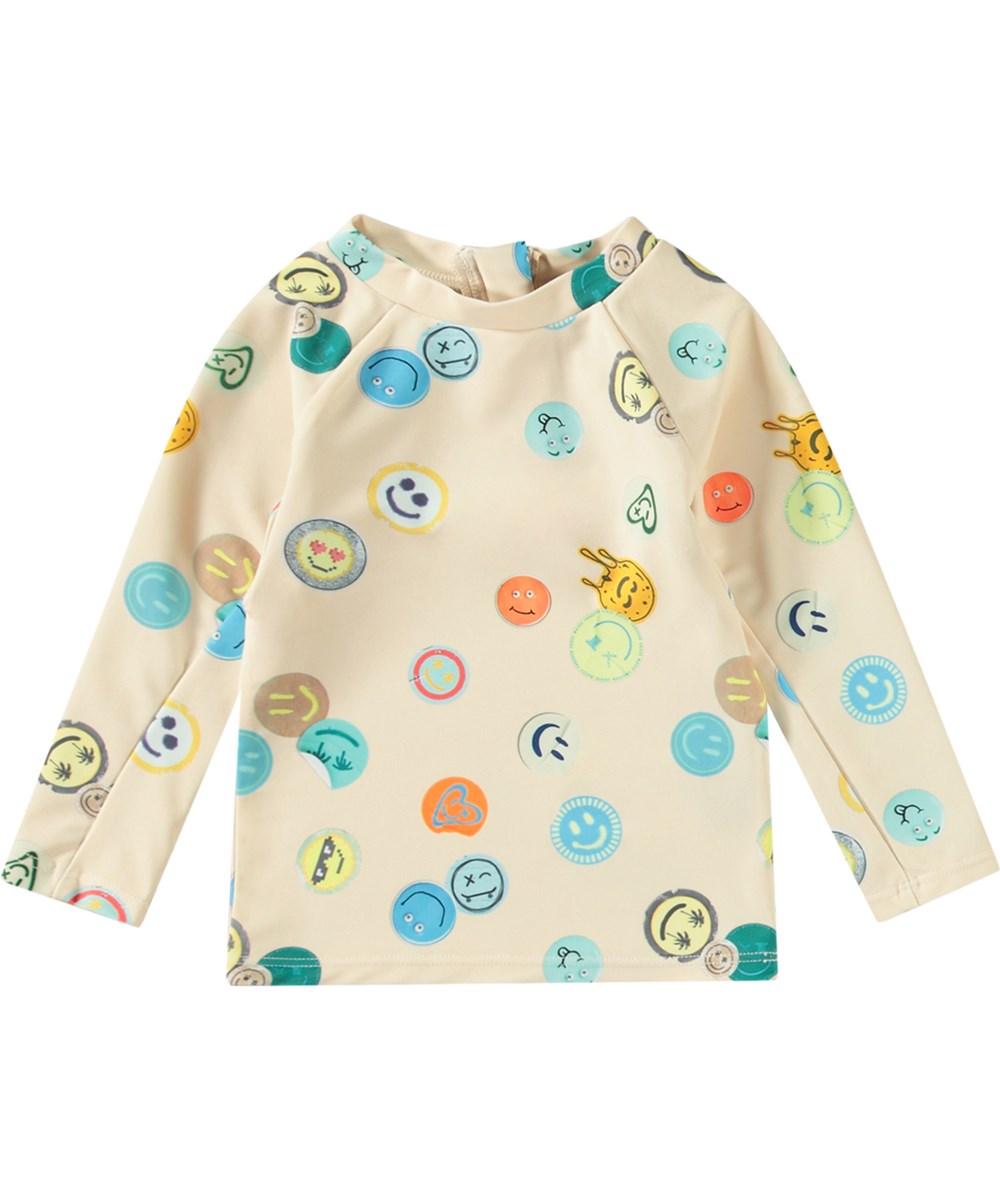 Nemo - Sand Smile - Beige baby rashguard in recycled polyester with UV protection 50+.