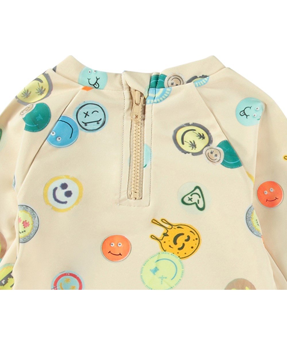 Nemo - Sand Smile - Beige baby rashguard in recycled polyester with UV protection 50+.
