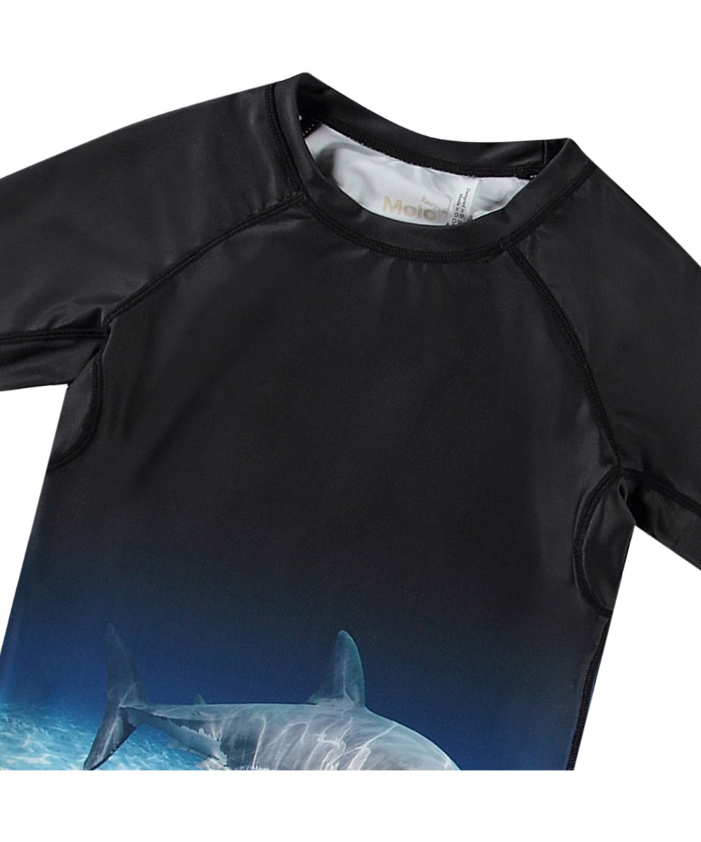 Neptune - Faded Shark - Black short sleeve rashguard for active chilldren  made from recycled polyester with UV protection 50+.