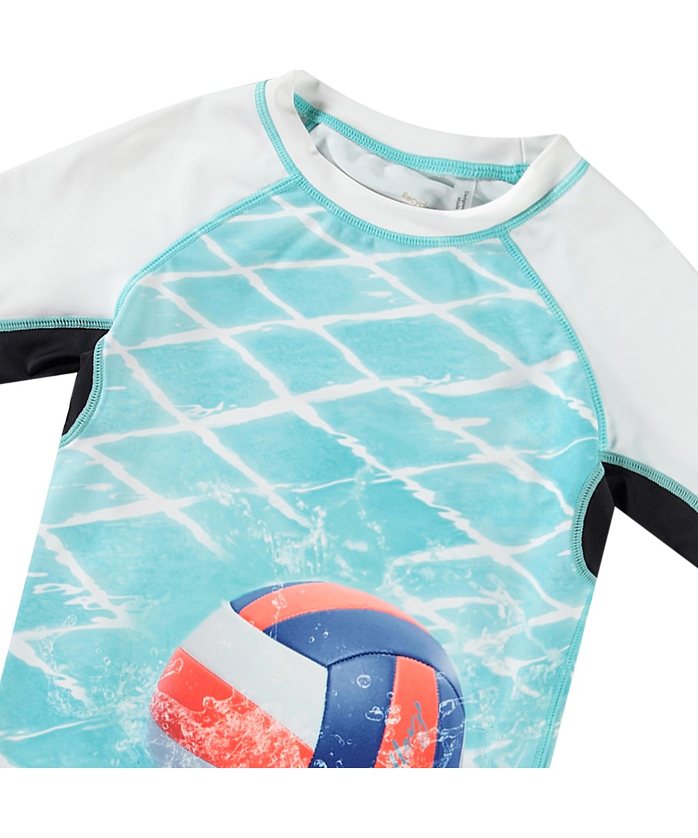 Neptune - Volleyball In Pool - White short sleeve rashguard for active children made from recycled polyester with UV protection 50+.