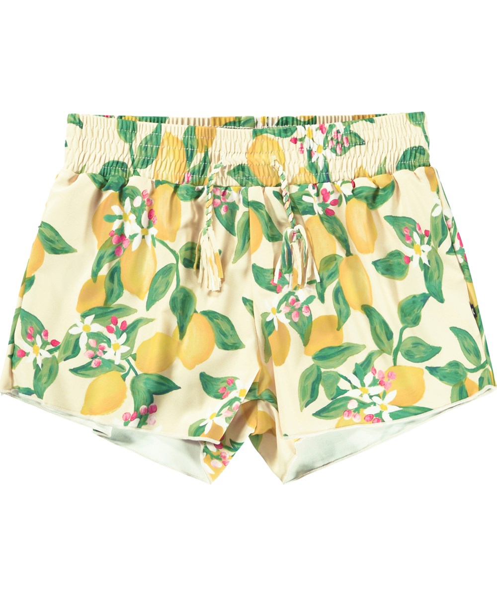 Nicci - Citrus - Swim shorts with citrus print for children made from recycled polyester with UV protection 50+.