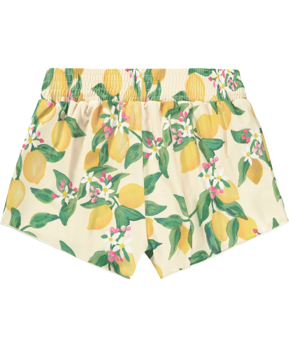 Nicci - Citrus - Swim shorts with citrus print for children made from recycled polyester with UV protection 50+.