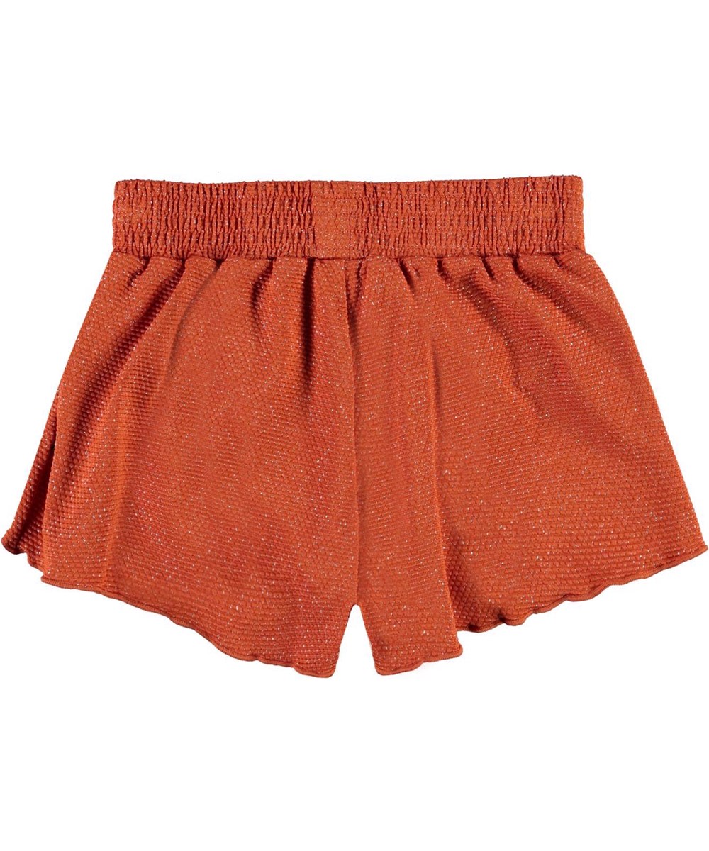 Nicci - Rusty - UV swim trunks in rust red with gold thread 