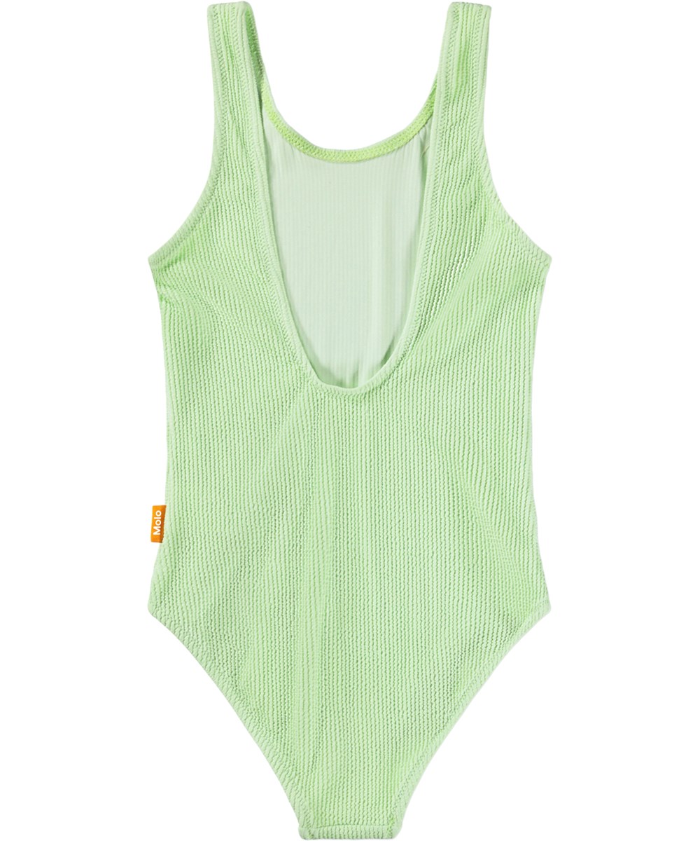 Nika Crepe - Pistachio - Green stretchy crepe swimsuit for children with UV protection 50+.