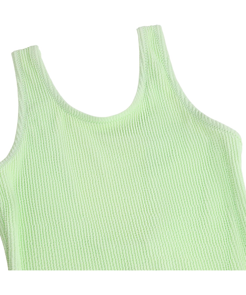 Nika Crepe - Pistachio - Green stretchy crepe swimsuit for children with UV protection 50+.