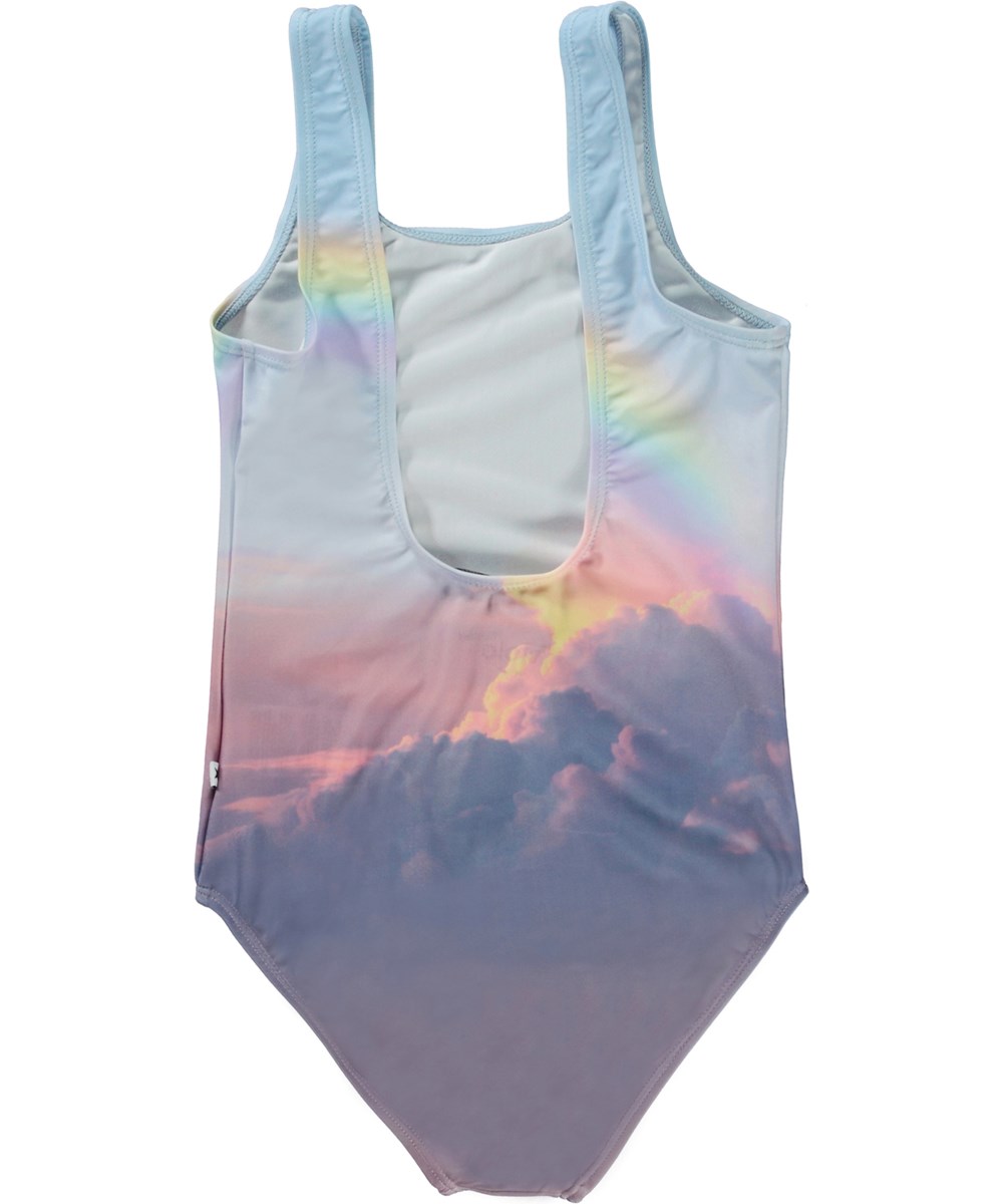 Nika - Enchanted Sky - Recycled light blue swimsuit with clouds and rainbow print 