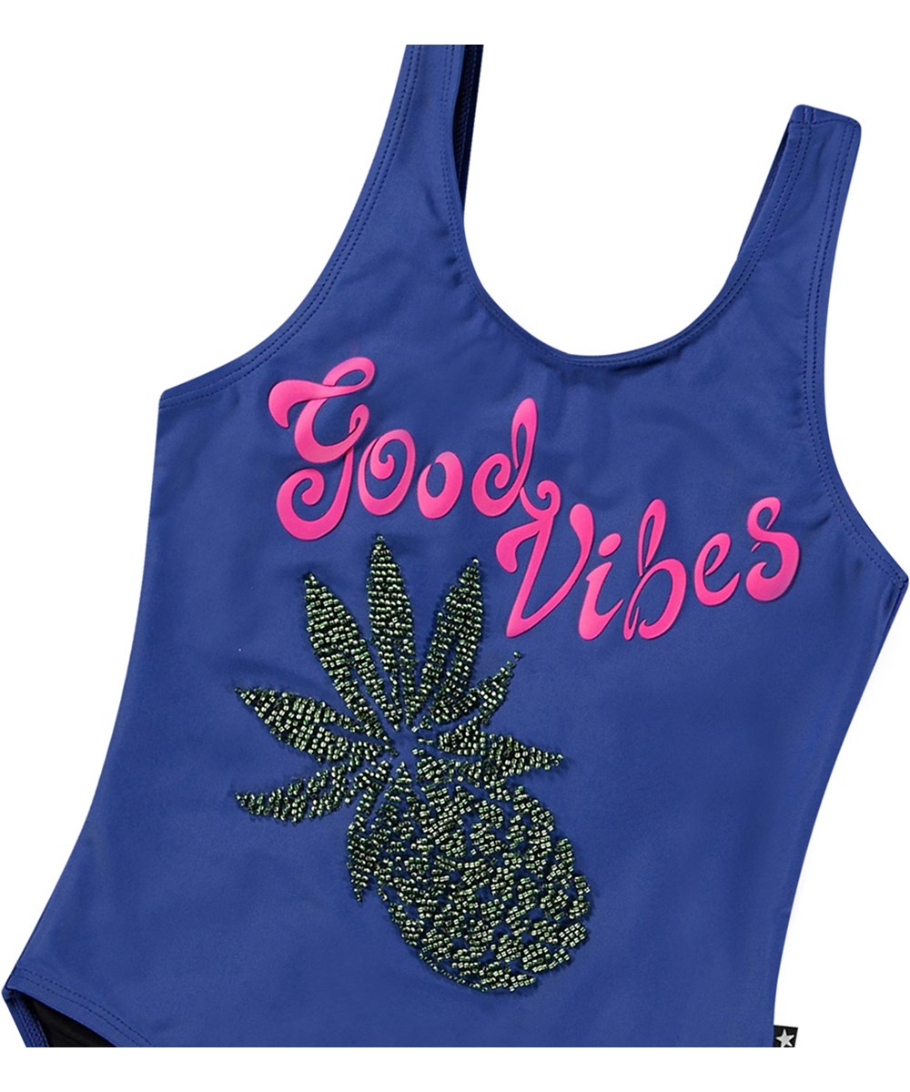 Nika - Sparkling Fruit - Blue swimsuit for active children in recycled polyester with UV protection 50+.