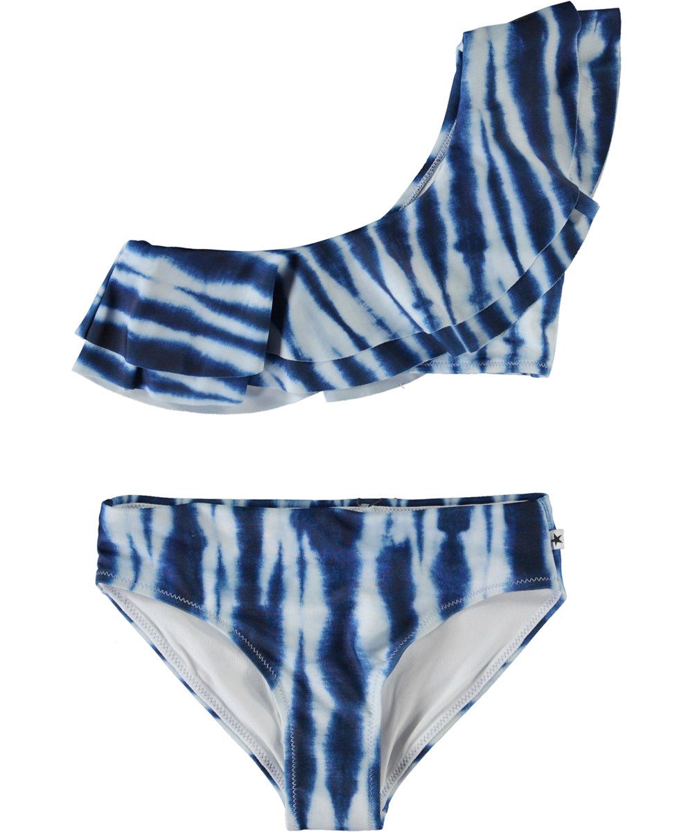 Nikkie - Tie Dye Vertical - Asymmetrical bikini in blue with tie-dye print and ruffle edge