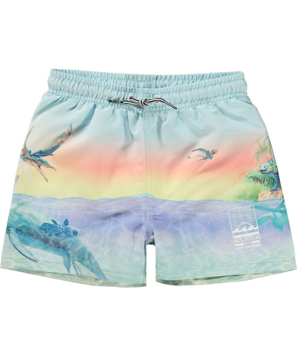 Niko - Ancient Island - Light coloured swim shorts with short legs and placement pastel dinosaur print 