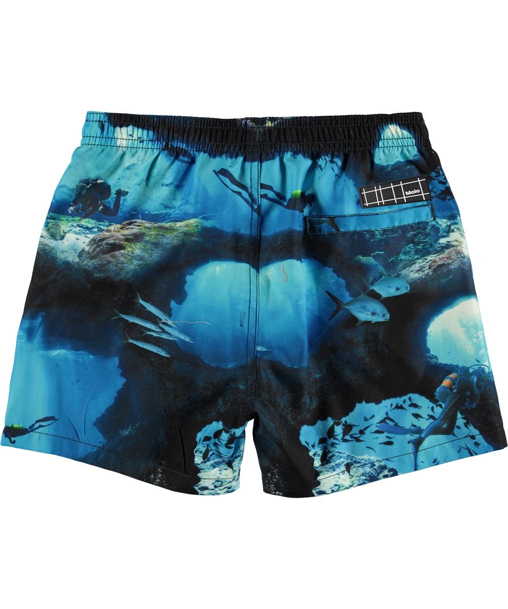 Niko - Cave Camo - UV swim trunks with diver print