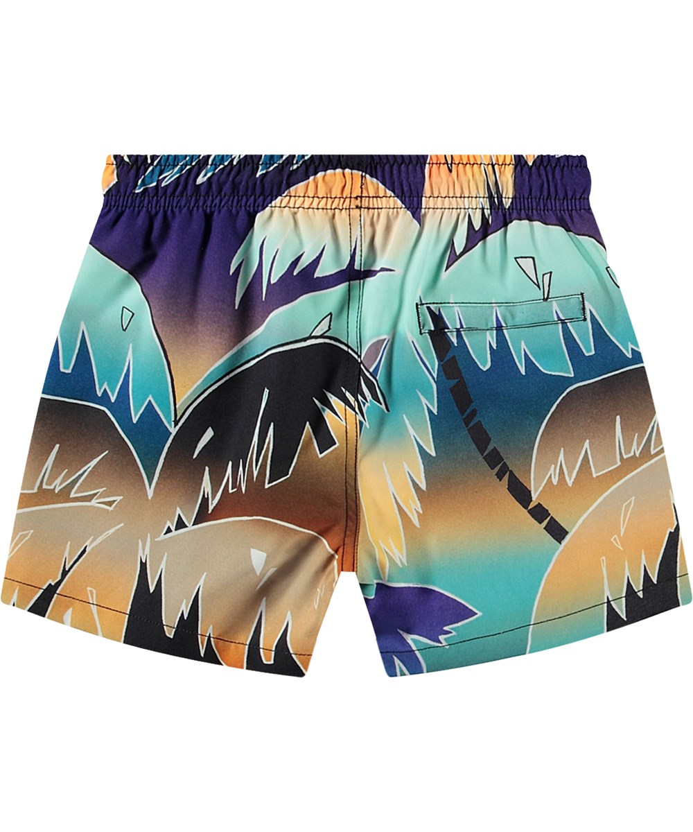 Niko - Faded Palmtrees - Sporty swim shorts for active children in recycled polyester with UV protection 50+.