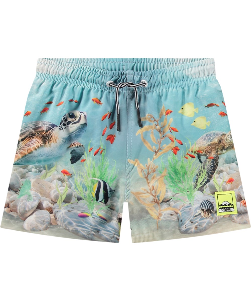 Niko - Happy Ocean - Light blue sporty swim shorts for active children in recycled polyester with UV protection 50+.
