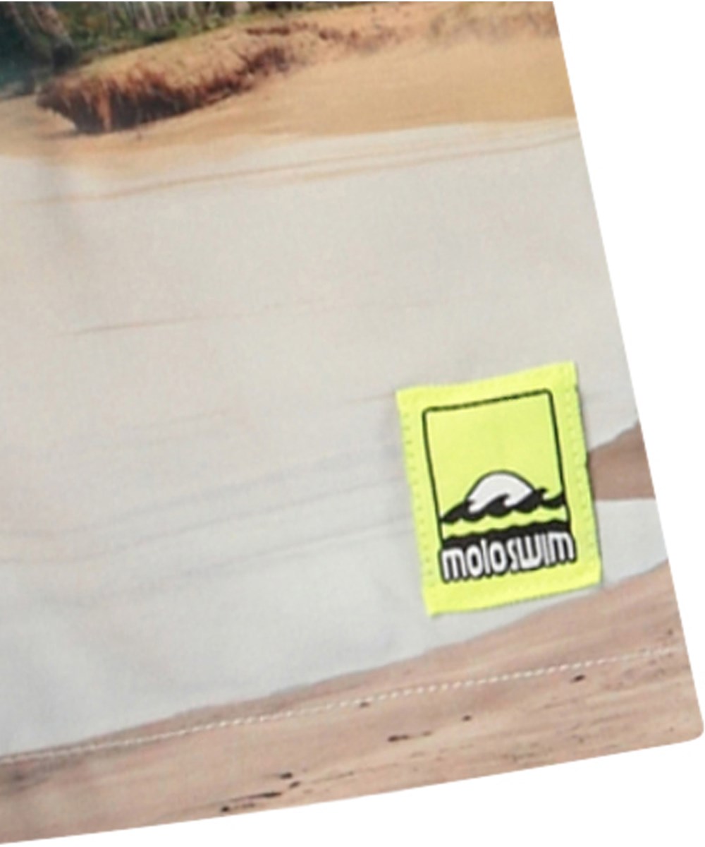 Niko - Island Surf - Light-coloured sporty swim shorts for active children in recycled polyester with UV protection 50+.