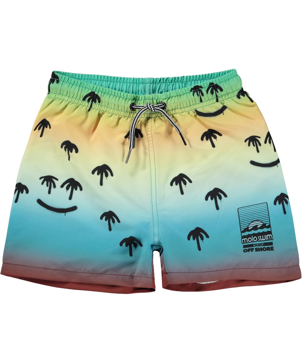 Niko - Palm Spray - Yellow and blue swim shorts with short legs and all over spray paint palm tree print 
