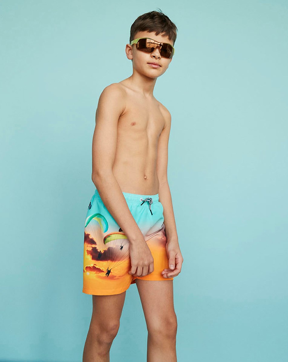 Niko - Parachute - Turquoise and orange swim shorts with skydivers 