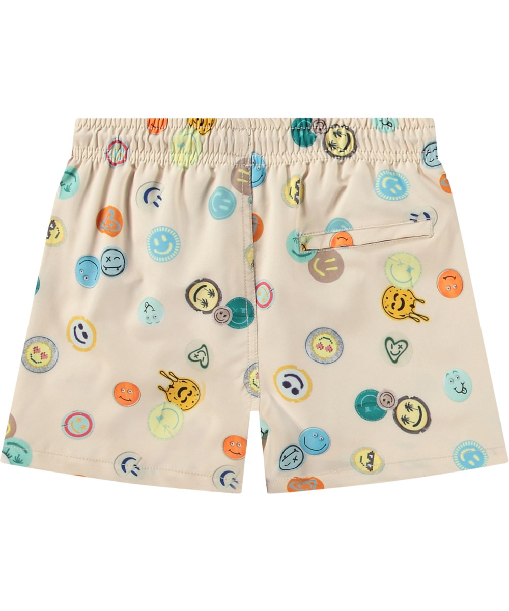 Niko - Sand Smile - Beige sporty swim shorts for active children in recycled polyester with UV protection 50+.